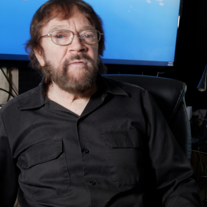 Del, the host of DIYDel, seated in front of a screen